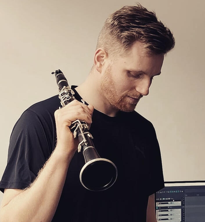 liam holding clarinet over his shoulder